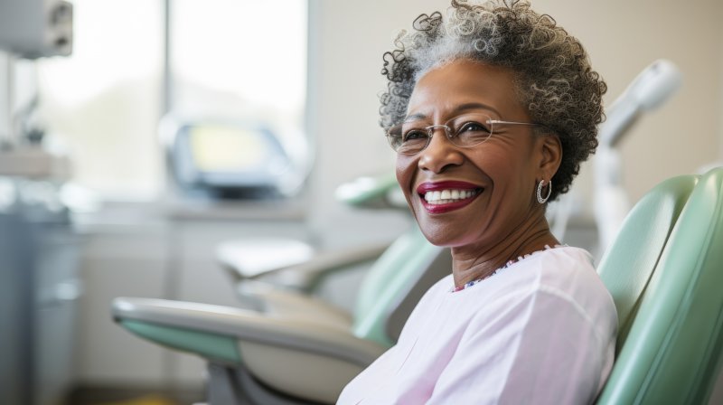 Patient smiling with their dentures