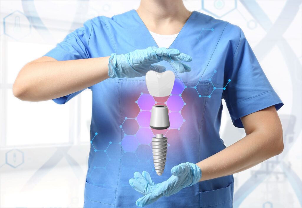 Neck to waist image of dentist in blue scrubs "holding" a levitating dental implant